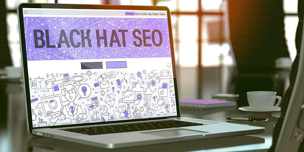 Laptop open with 'Blackhat SEO' on the screen