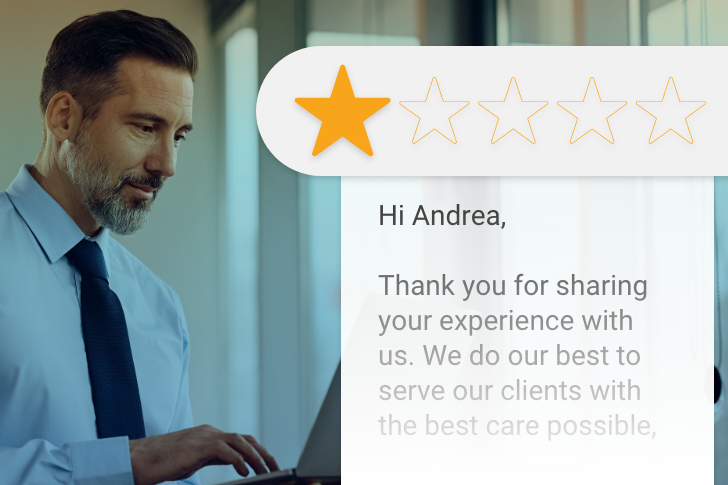 Doctor responding to a 1-star review on his laptop